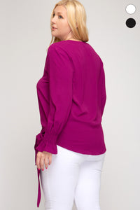 Smocked long sleeve surplice woven top