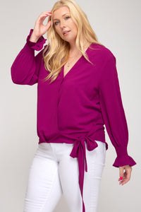 Smocked long sleeve surplice woven top